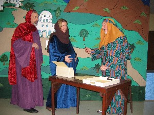 Mary and Joseph with Census Counter